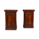 A PAIR OF MAHOGANY PEDESTAL CUPBOARDS