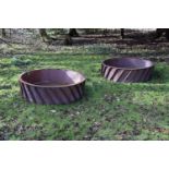 A PAIR OF SUBSTANTIAL CAST IRON AND SHEET METAL LINED CIRCULAR PLANTERSLATE 20TH CENTURYOf openwor