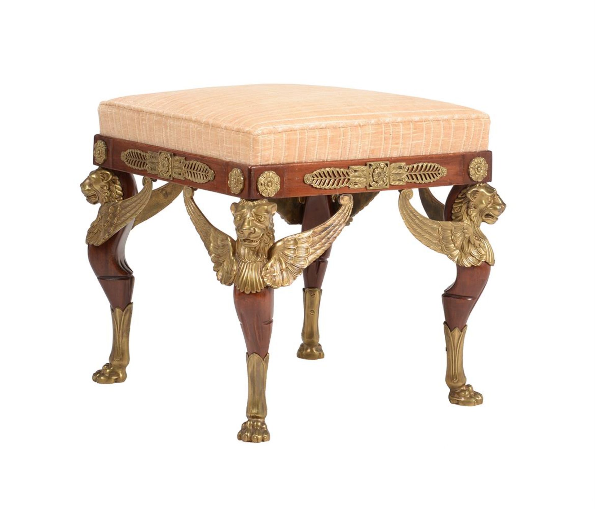 A MAHOGANY AND GILT METAL MOUNTED FOOT STOOL IN EMPIRE STYLE