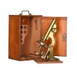 A LARGE VICTORIAN LACQUERED BRASS COMPOUND MINOCULAR POLARISING MICROSCOPE