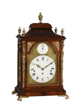 A GEORGE III BRASS MOUNTED MAHOGANY QUARTER-CHIMING TABLE CLOCK WITH FIRED ENAMEL DIAL INSERTS