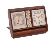 A SWISS LEATHER-CASED TRAVELLING ALARM TIMEPIECE COMPENDIUM WITH BAROMETER AND THERMOMETER