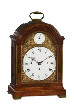 A FINE BRASS MOUNTED MAHOGANY QUARTER-CHIMING TABLE CLOCK WITH FIRED ENAMEL DIAL INSERTS