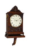 A WILLIAM IV CARVED AND BRASS INLAID MAHOGANY BRACKET CLOCK WITH WALL BRACKET
