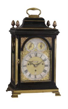 A FINE GEORGE III BRASS MOUNTED EBONISED QUARTER-CHIMING TABLE CLOCK