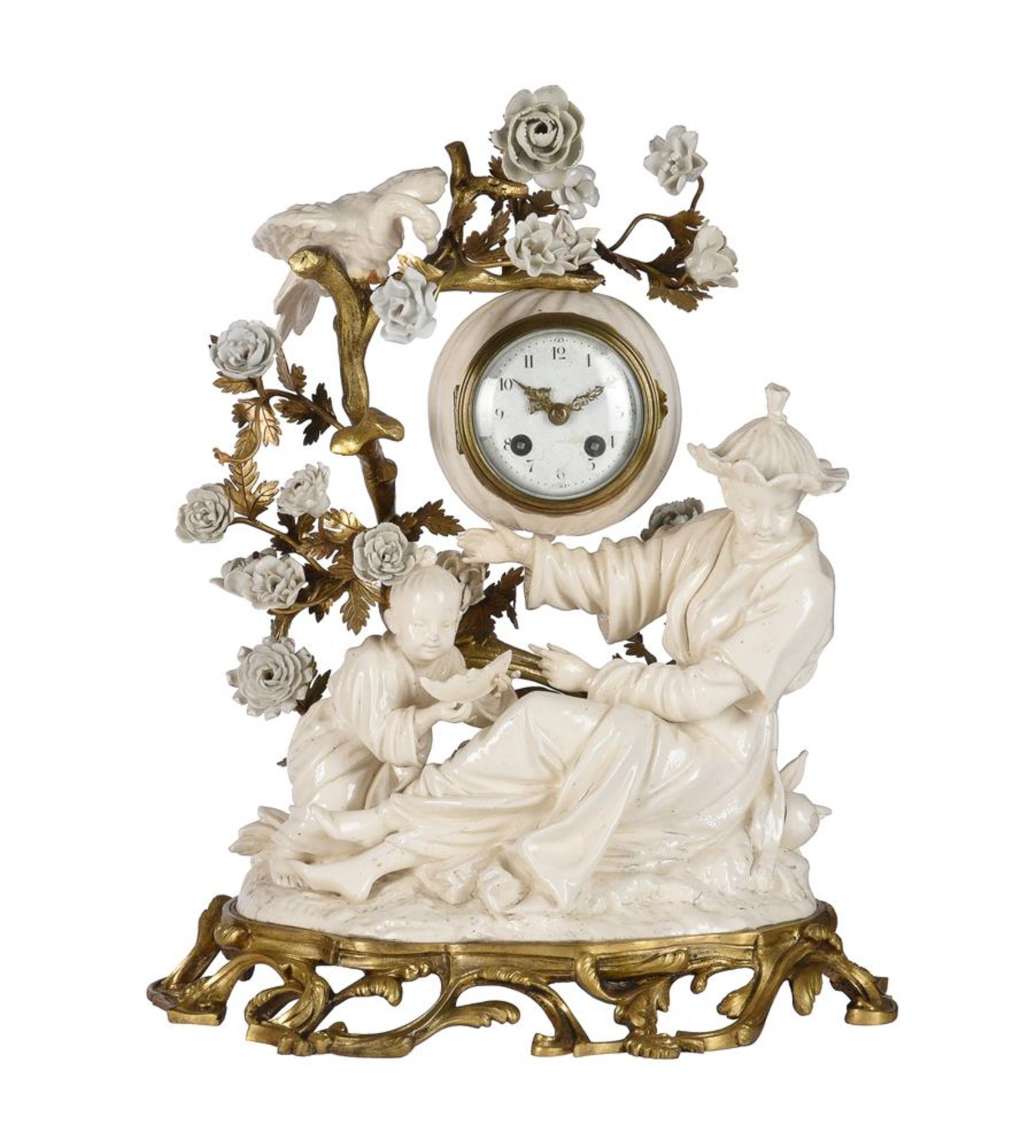 A LOUIS XV STYLE ORMOLU AND 'BLANC DE CHINE' PORCELAIN MANTEL CLOCK