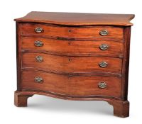 A GEORGE III MAHOGANY SERPENTINE COMMODE, CIRCA 1785