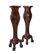 A LARGE PAIR OF CARVED WALNUT TORCHERE STANDS, IN GEORGE II STYLE, LATE 19TH CENTURY