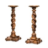 A PAIR OF ITALIAN CARVED WALNUT TORCHERES, IN 17TH CENTURY STYLE, 19TH CENTURY