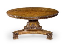 A REGENCY FIGURED AND CARVED MAHOGANY CENTRE TABLE, IN THE MANNER OF GILLOWS, CIRCA 1820