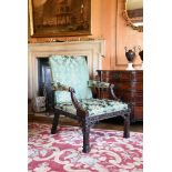 A CARVED MAHOGANY GAINSBOROUGH ARMCHAIR, IN GEORGE III STYLE