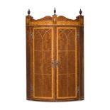 Y A MAHOGANY AND SATINWOOD BANDED BOW FRONT HANGING CORNER CABINET, LATE 19TH CENTURY