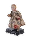 Y A SPANISH COLONIAL CARVED POLYCHROME FIGURE OF THE SEATED CHRIST, 17TH CENTURY