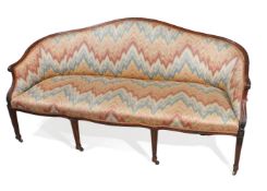 A GEORGE III CARVED MAHOGANY AND UPHOLSTERED SOFA, CIRCA 1790