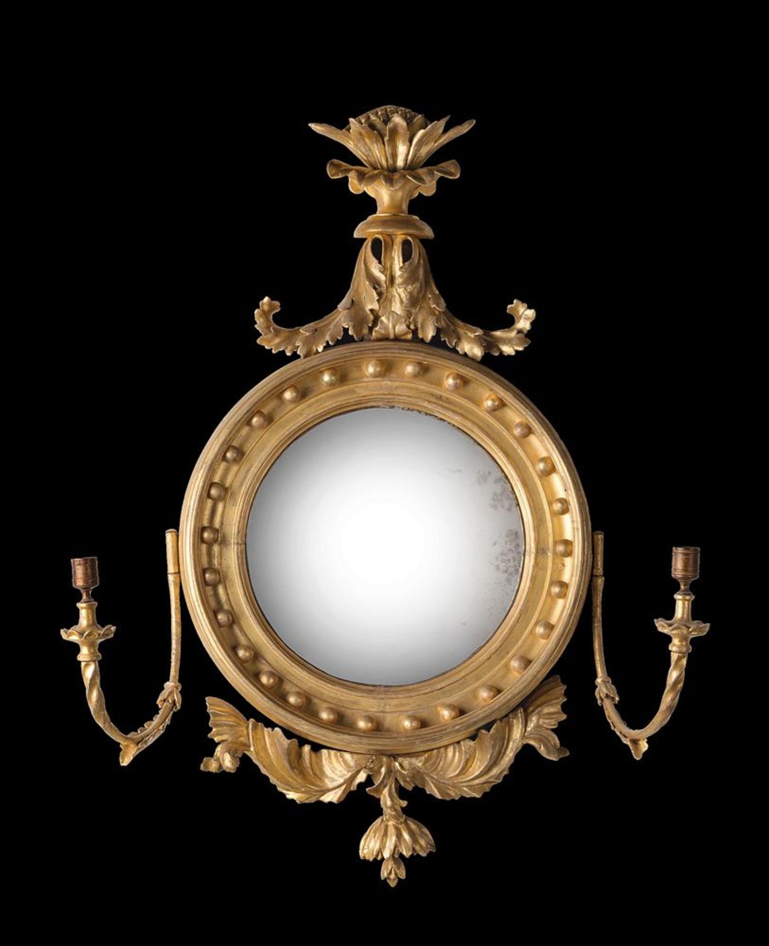 A REGENCY CARVED GILTWOOD CONVEX MIRROR, CIRCA 1820