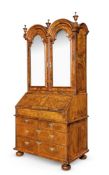 A QUEEN ANNE FIGURED WALNUT AND FEATHER BANDED BUREAU CABINET, CIRCA 1710