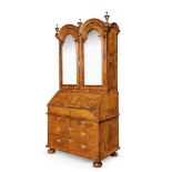 A QUEEN ANNE FIGURED WALNUT AND FEATHER BANDED BUREAU CABINET, CIRCA 1710