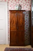 A REGENCY MAHOGANY CUPBOARD, CIRCA 1815