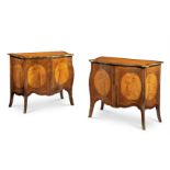 Y A PAIR OF TULIPWOOD AND HAREWOOD SERPENTINE COMMODES, IN GEORGE III STYLE