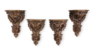 A SET OF FOUR LARGE CARVED WALNUT WALL BRACKETS, IN 18TH CENTURY STYLE