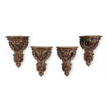 A SET OF FOUR LARGE CARVED WALNUT WALL BRACKETS, IN 18TH CENTURY STYLE