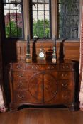 A GEORGE III FIGURED MAHOGANY SERPENTINE COMMODE, IN THE MANNER OF THOMAS CHIPPENDALE, CIRCA 1770