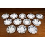 A SET OF TEN SILVER DISHES AND TWELVE STANDS, NAT LESLIE LTD., LONDON 1966