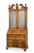 A WALNUT AND PARCEL GILT BUREAU BOOKCASE, MID 18TH CENTURY AND LATER