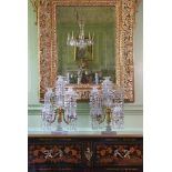 A PAIR OF ORNATE CUT GLASS, GILT BRONZE AND METAL MOUNTED FIVE LIGHT TABLE CANDELABRA