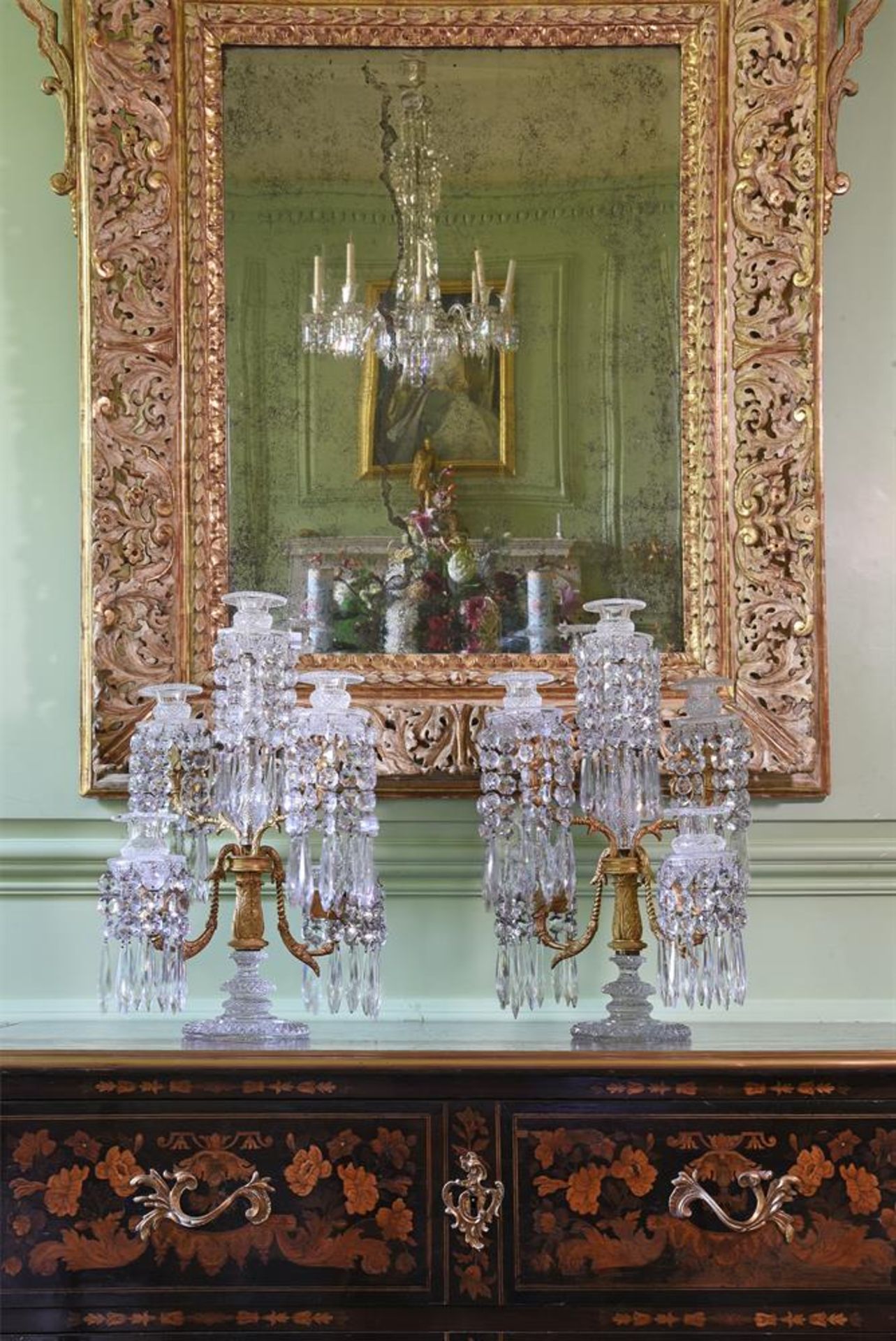 A PAIR OF ORNATE CUT GLASS, GILT BRONZE AND METAL MOUNTED FIVE LIGHT TABLE CANDELABRA