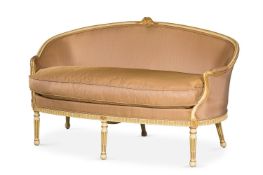 A LOUIS XVI CREAM PAINTED AND PARCEL GILT CANAPÉ, CIRCA 1800