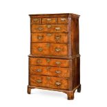 A GEORGE II WALNUT AND FEATHER BANDED CHEST ON CHEST, CIRCA 1730