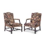 A PAIR OF CARVED BEECH AND NEEDLEWORK UPHOLSTERED GAINSBOROUGH ARMCHAIRS, IN GEORGE III STYLE