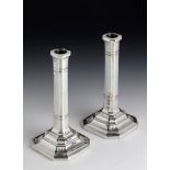 A PAIR OF VICTORIAN SILVER CANDLESTICKS, EDWARD HUTTON, LONDON 1886