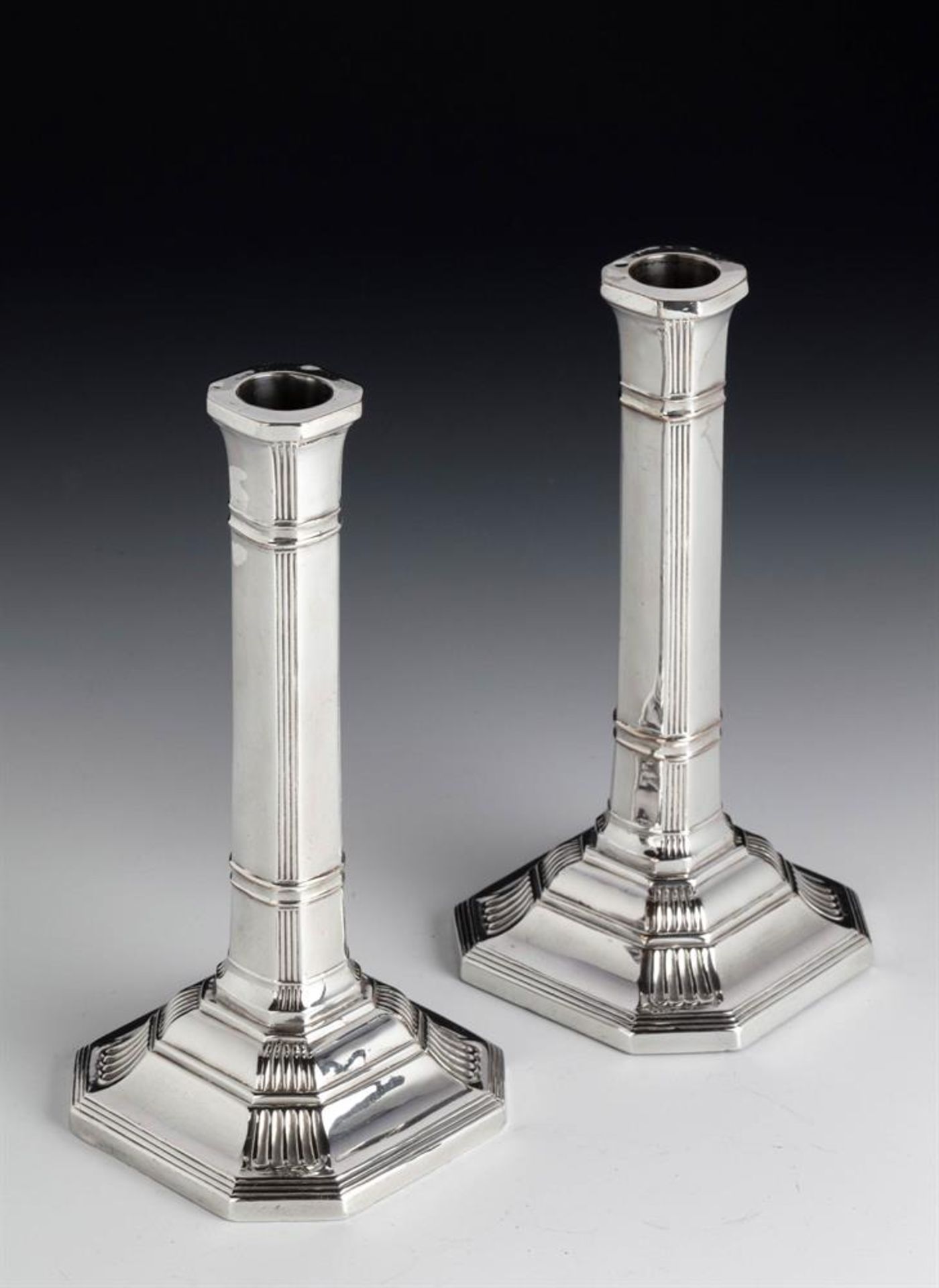 A PAIR OF VICTORIAN SILVER CANDLESTICKS, EDWARD HUTTON, LONDON 1886