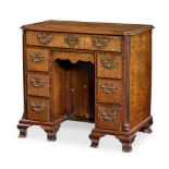 A GEORGE III 'FUSTIC' MAHOGANY KNEEHOLE DESK, CIRCA 1770