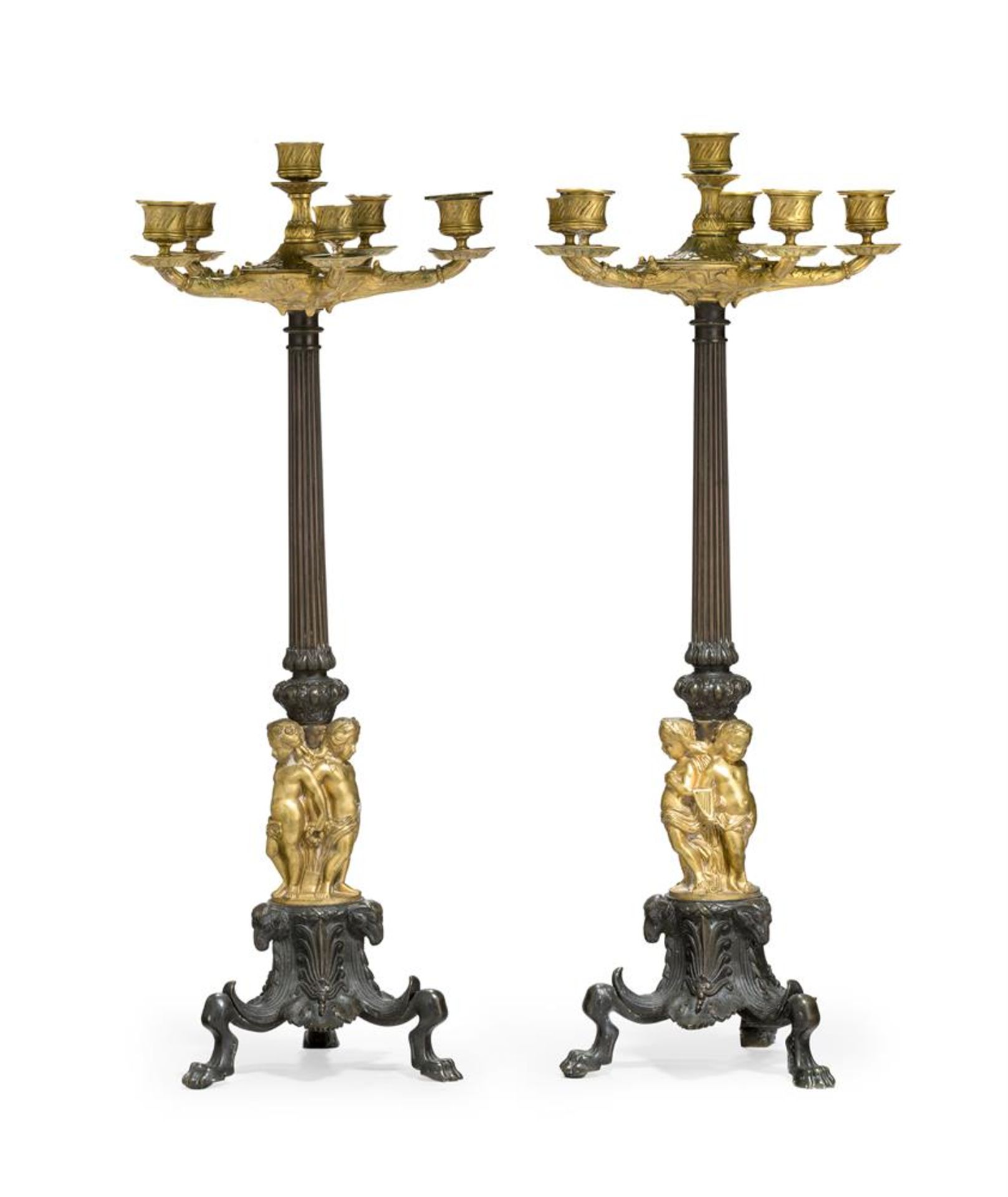 A LARGE PAIR OF PATINATED AND PARCEL GILT SIX LIGHT CANDELABRA, 19TH CENTURY