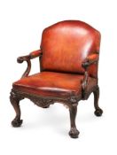 A CARVED MAHOGANY AND LEATHER UPHOLSTERED OPEN ARMCHAIR, IN GEORGE III STYLE, EARLY 20TH CENTURY