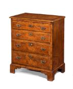 A GEORGE II WALNUT, BURR WALNUT, BURR YEW AND FEATHER BANDED BACHELOR'S CHEST OF DRAWERS, CIRCA 1730