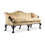 A CARVED MAHOGANY AND UPHOLSTERED SOFA, IN GEORGE II STYLE, 19TH CENTURY