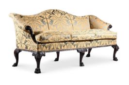 A CARVED MAHOGANY AND UPHOLSTERED SOFA, IN GEORGE II STYLE, 19TH CENTURY