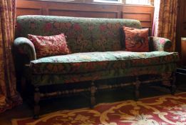 A WALNUT AND FLORAL UPHOLSTERED SOFA, 18TH CENTURY AND LATER