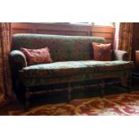 A WALNUT AND FLORAL UPHOLSTERED SOFA, 18TH CENTURY AND LATER