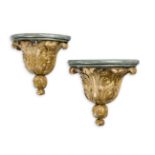 A PAIR OF CARVED GILTWOOD AND GREEN PAINTED WALL BRACKETS, IN MID 18TH CENTURY STYLE