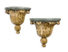 A PAIR OF CARVED GILTWOOD AND GREEN PAINTED WALL BRACKETS, IN MID 18TH CENTURY STYLE