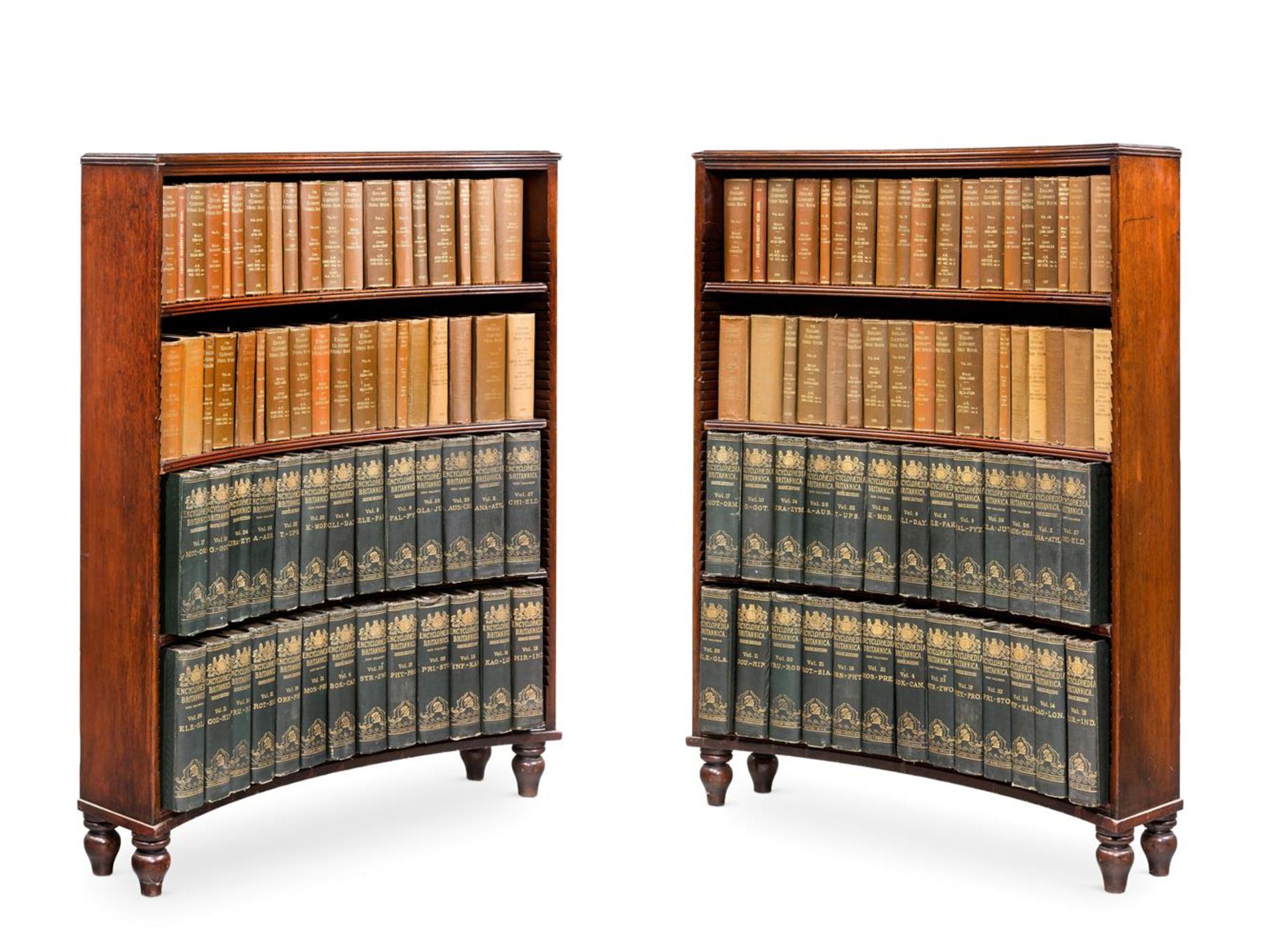 AN UNUSUAL PAIR OF GEORGE III MAHOGANY CONCAVE OPEN BOOKCASES, CIRCA 1810