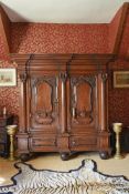 A LARGE NORTH EUROPEAN CARVED OAK ARMOIRE, 18TH CENTURY