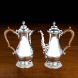 A SILVER COFFEE POT AND HOT WATER JUG MAKER'S MARK CH JW (NOT TRACED) LONDON 1929of baluster form