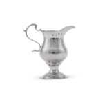 A GEORGE III SILVER CREAM JUG