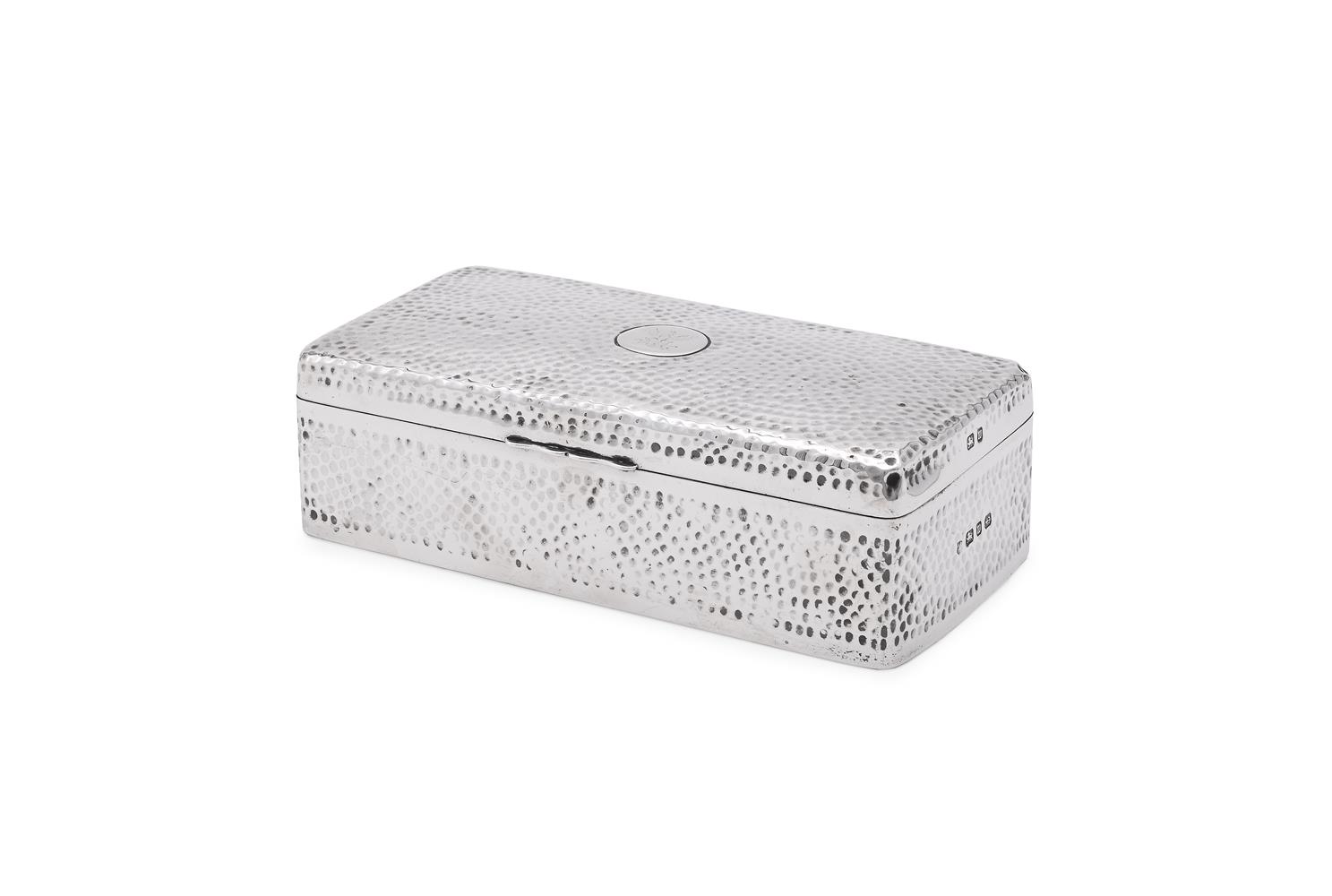 A VICTORIAN SILVER HAMMERED RECTANGULAR CIGARETTE BOX